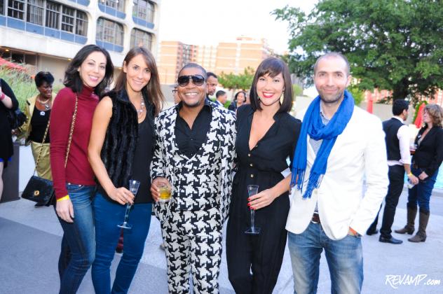 '30 Americans' artist Kehinde Wiley is surrounded by Cocoran Gallery of Art team members.